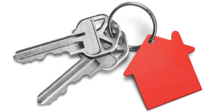 Set of Keys With Red House Isolated on White Background.