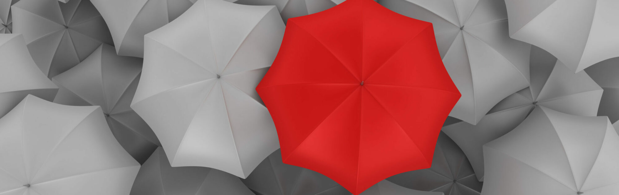 Red Umbrella with Many Gray Ones