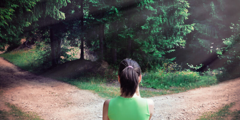 Girl with a choice near the forked road